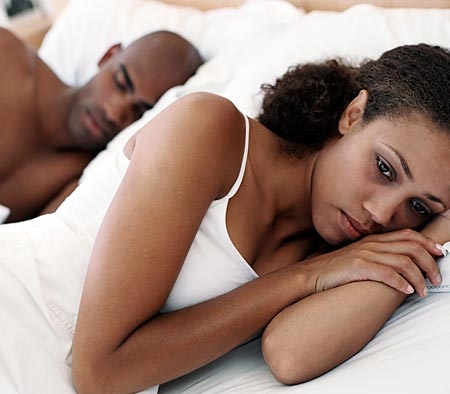 couple-in-bed-distressed-woman